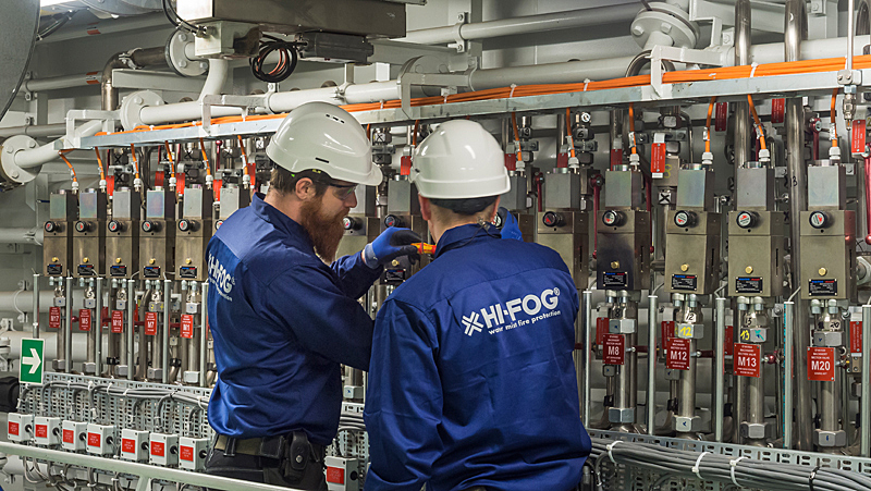 Service Engineers checking valve maniford